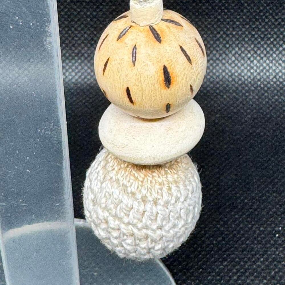 White crochet and wood bead